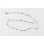 An untested white metal & seed pearl necklace, 15.75ins. (40cms.) long, boxed.