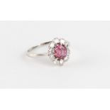 An 18ct white gold certificated unheated Thai ruby & diamond oval flowerhead cluster ring, the