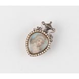 A Georgian portrait miniature brooch with suspension ring to be worn as a pendant, the portrait