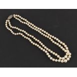 Property of a lady - a Mikimoto cultured pearl two strand necklace, the largest of the 128 pearls