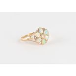 A late 19th / early 20th century yellow gold opal & diamond flowerhead cluster ring, with six oval