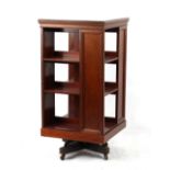 Property of a gentleman - an Edwardian mahogany three-tier revolving bookcase, 46.2ins. (117.
