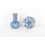 Property of a gentleman - an Iznik design bottle vase, 10.65ins. (27cms.) high; together with a late