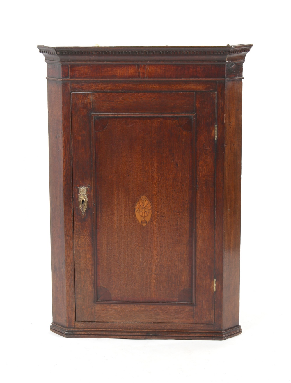 Property of a gentleman - a George III oak & mahogany corner wall cabinet, with inlaid urn motif,