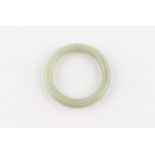 A late 19th / early 20th century Chinese jade bangle, 77mm diameter (overall).