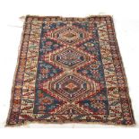 Property of a lady - an early 20th century antique Caucasian Shirvan rug, with blue field, worn,