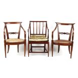 Property of a gentleman - a pair of early 19th century Continental cane seated elbow chairs, with