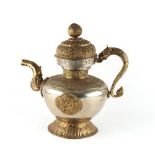 A large Tibetan gilt & white metal ewer & cover, 19th century, 14.25ins. (36.2cms.) high.