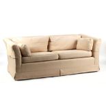 Property of a deceased estate - a modern beige coloured sofa, approximately 73ins. (186cms.) long.