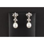 A pair of unmarked white gold diamond & South Seas pearl floral pendant earrings, the pearls each