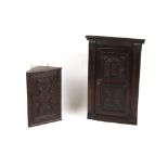Property of a gentleman - two small carved oak corner wall cabinets, the larger 28ins. (71cms.) high