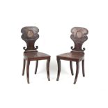 Property of a gentleman - a pair of early 19th century Regency period mahogany hall chairs, with