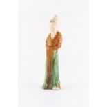 Property of a lady - a Chinese Tang Dynasty sancai glazed pottery figure of a lady, 10.25ins. (