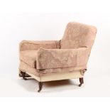 Property of a deceased estate - a late Victorian armchair with later upholstery, with turned front