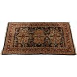 Property of a gentleman - a modern Caucasian design hand knotted wool rug, 75 by 51ins. (190 by