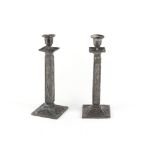 A pair of Japanese metal square section candlesticks, Meiji period, late 19th / early 20th