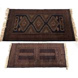 Property of a gentleman - two modern Turkoman design hand knotted wool rugs, 78 by 51ins. (198 by