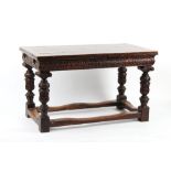 Property of a gentleman - a carved oak draw-leaf dining table, early 20th century, parts possibly
