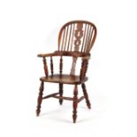 Property of a deceased estate - a Victorian Windsor elbow chair, with turned legs & stretchers.