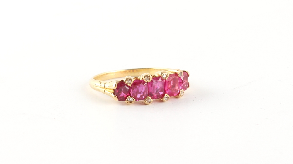 An unmarked yellow gold (tests 18ct) certificated Burmese ruby five stone ring, the five unheated