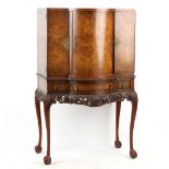 Property of a lady - a 1930's/40's walnut cocktail cabinet, with revolving centre section, 39ins. (