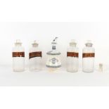 Property of a gentleman - four chemist's rounds or glass jars or bottles, all with labels, one