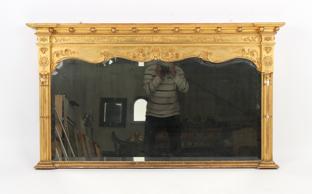 Property of a lady - an Edwardian gilt framed overmantel mirror, with shaped & bevelled glass plate,