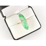 An 18ct yellow gold carved jadeite & diamond ring, the large jadeite panel with apple green