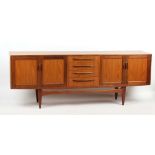 Property of a deceased estate - a teak sideboard, possibly G-Plan, 83.75ins. (213cms.) long.