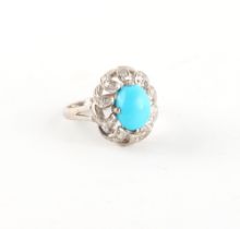 A 14ct white gold turquoise & diamond pierced floral ring, size L/M.