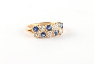 An unmarked yellow gold (tests 18ct) sapphire & diamond ring, set with two rows of five