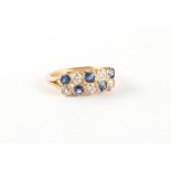 An unmarked yellow gold (tests 18ct) sapphire & diamond ring, set with two rows of five