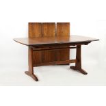 Property of a lady - an Ercol rectangular topped extending dining table, with three extra leaves,