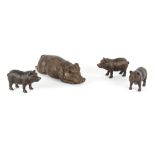 Property of a lady - a bronzed resin model of a recumbent pig, 18.3ins. (46.5cms.) long; together