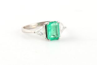 A good unmarked 18ct white gold (tested) emerald & diamond three stone ring, the certificated