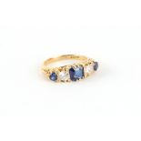 Property of a lady - an 18ct yellow gold sapphire & diamond ring, the emerald cut centre sapphire