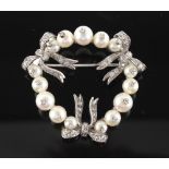 Rene Kern, Paris - a platinum pearl & diamond wreath brooch, signed & numbered 302, the estimated