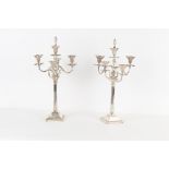 Property of a gentleman - a large pair of silver plated five light candelabra, with flambeau finials