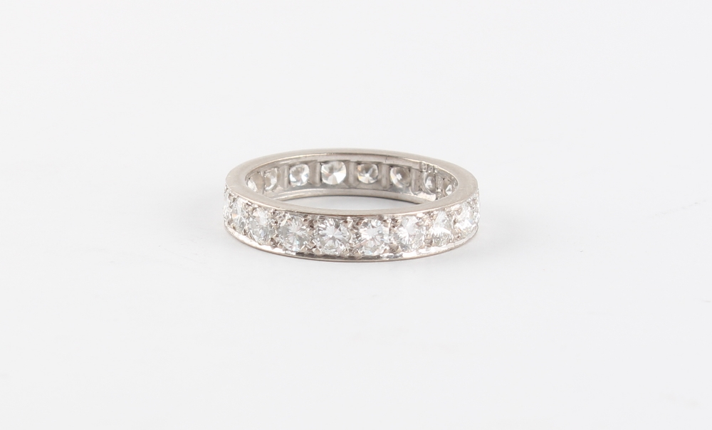 An 18ct white gold diamond eternity ring, the round brilliant cut diamonds weighing an estimated