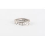 An 18ct white gold diamond eternity ring, the round brilliant cut diamonds weighing an estimated