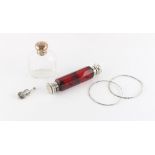 Property of a gentleman - a late 19th / early 20th century ruby glass double ended scent bottle;