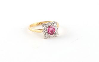 An 18ct yellow gold ruby & diamond shaped square panel ring, the ruby weighing an estimated 0.69