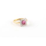 An 18ct yellow gold ruby & diamond shaped square panel ring, the ruby weighing an estimated 0.69