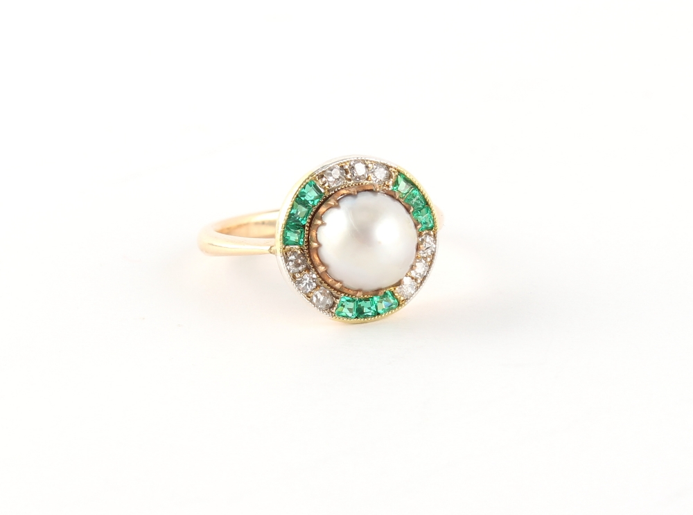 An unmarked yellow gold certificated natural saltwater pearl emerald & diamond ring, the silver