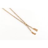 Property of a lady - a 9ct two colour gold twin tassel necklace, approximately 18ins. (46cms.) long,