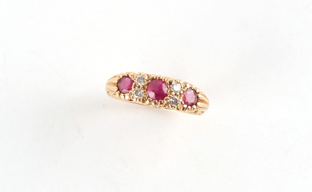 Property of a lady - an 18ct yellow gold ruby & diamond seven stone ring, the centre round cut - Image 2 of 2