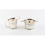 Property of a lady - an Art Deco silver milk jug and matching sugar basin, rubbed marks,