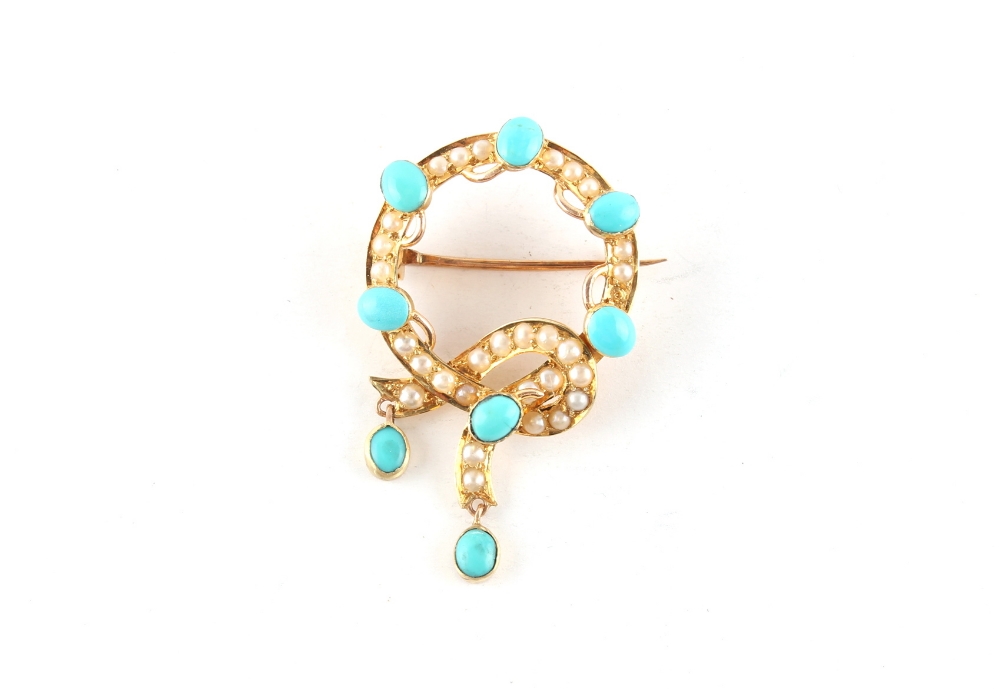 An unmarked yellow gold (tests 14/15ct) turquoise & seed pearl garter brooch, 39mm long.