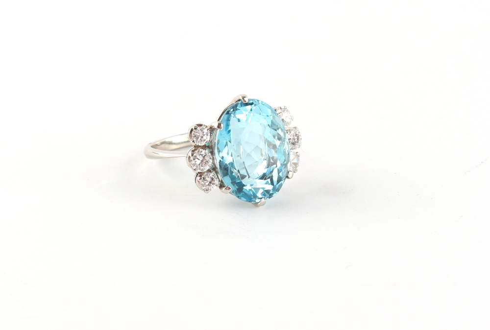 A fine aquamarine & diamond ring, the oval cut aquamarine of vibrant colour & excellent clarity,