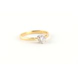 An 18ct yellow gold diamond single stone ring, the round brilliant cut diamond weighing